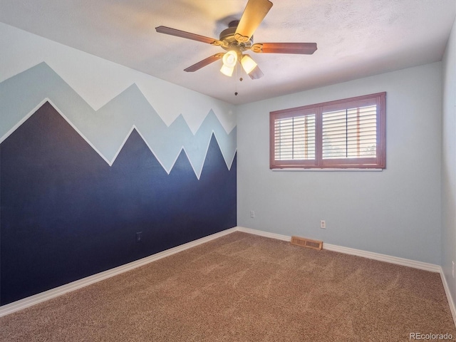 5945 W Morraine Ave, Littleton, CO 80128 - empty room with visible vents, baseboards, a ceiling fan, and carpet