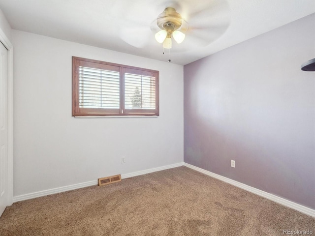 5945 W Morraine Ave, Littleton, CO 80128 - carpeted spare room featuring visible vents, baseboards, and a ceiling fan