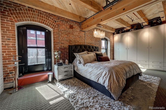 bedroom with beam ceiling, brick wall, carpet floors, and wood ceiling