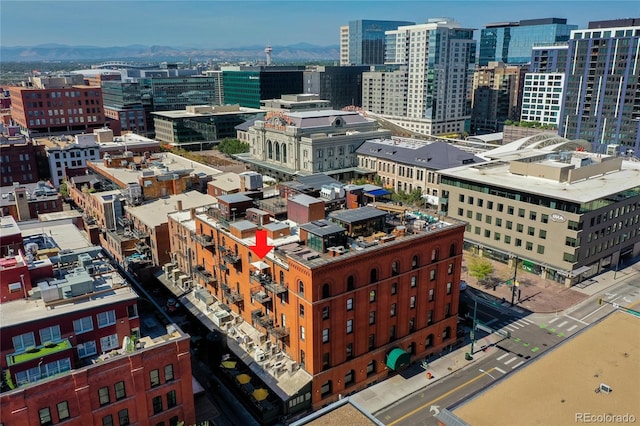 property's view of city with a mountain view