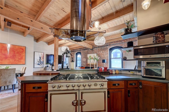 kitchen featuring beam ceiling, stainless steel microwave, pendant lighting, wood ceiling, and light wood-type flooring