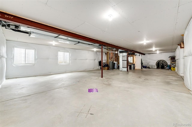 196 W 8th Ave, Byers, CO 80103 - garage featuring water heater and heating unit