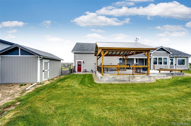 196 W 8th Ave, Byers, CO 80103 - back of house with a gazebo, a lawn, a patio area, and an outbuilding