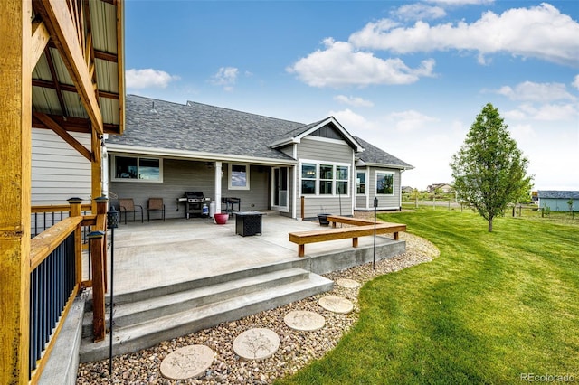 196 W 8th Ave, Byers, CO 80103 - back of house featuring a patio and a shingled roof