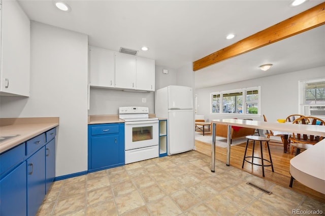 kitchen featuring white appliances, blue cabinets, recessed lighting, light countertops, and white cabinetry