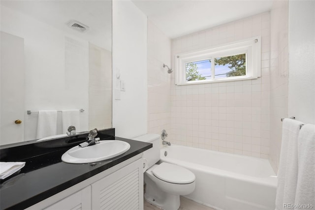 full bath with washtub / shower combination, toilet, and vanity