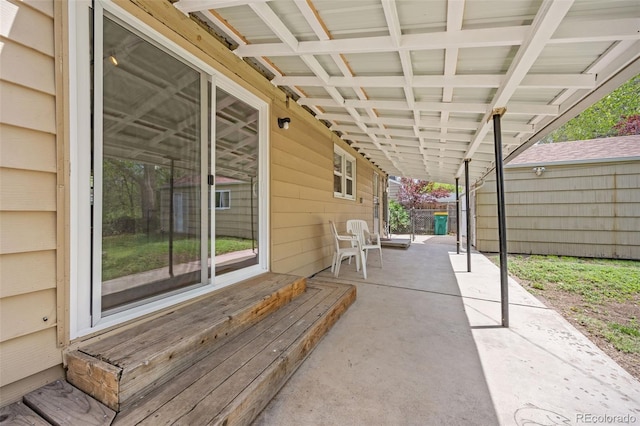 view of patio / terrace featuring fence