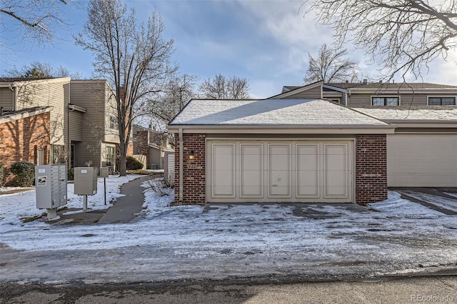 view of snow covered garage