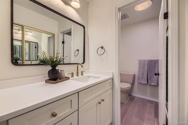 bathroom with toilet and vanity