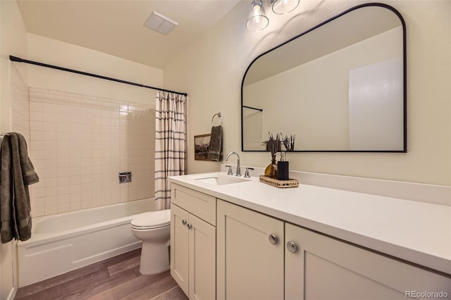 full bathroom featuring toilet, vanity, shower / bath combo, and hardwood / wood-style flooring