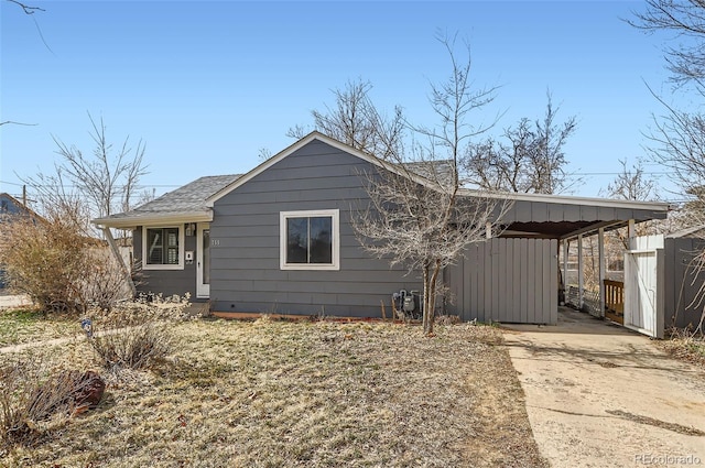 back of property with a shingled roof