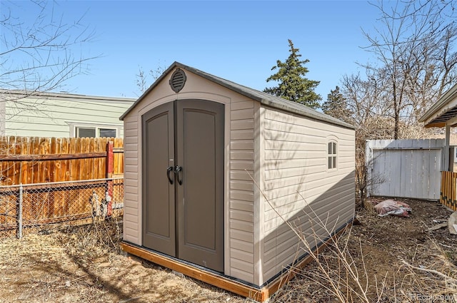 view of shed featuring a fenced backyard