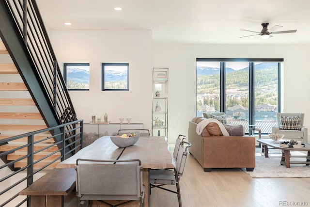 dining area featuring light hardwood / wood-style floors and ceiling fan