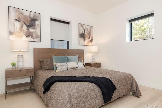 bedroom with light hardwood / wood-style flooring