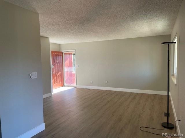1415 Bacchus Dr Unit D9, Lafayette, CO 80026 - spare room with a textured ceiling and wood finished floors