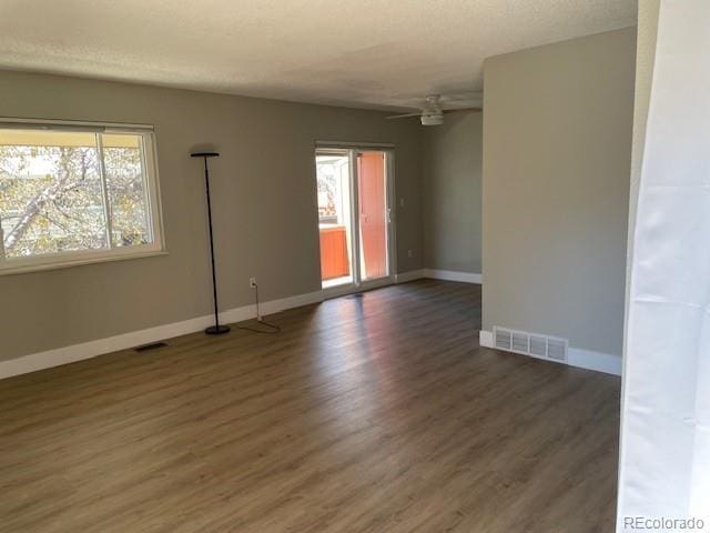 1415 Bacchus Dr Unit D9, Lafayette, CO 80026 - unfurnished room with healthy amount of natural light, wood finished floors, and ceiling fan