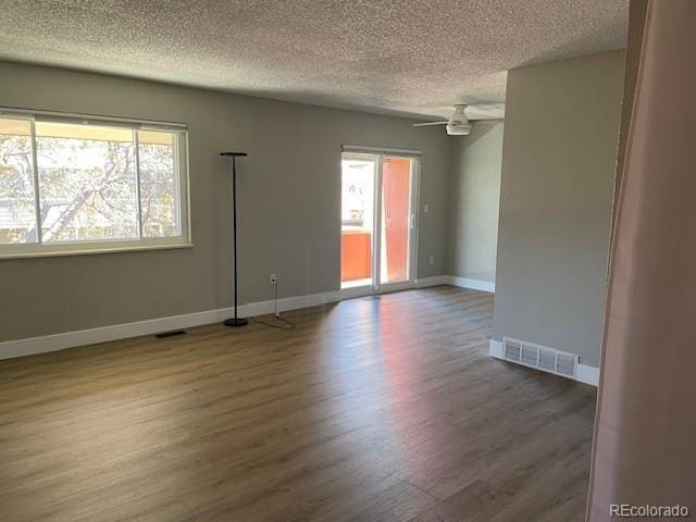 1415 Bacchus Dr Unit D9, Lafayette, CO 80026 - spare room featuring a textured ceiling, wood finished floors, and ceiling fan