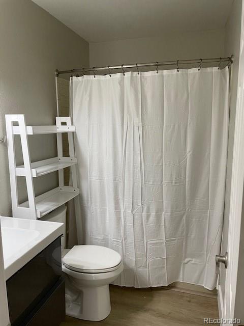 1415 Bacchus Dr Unit D9, Lafayette, CO 80026 - full bath with wood finished floors, vanity, and a shower with curtain