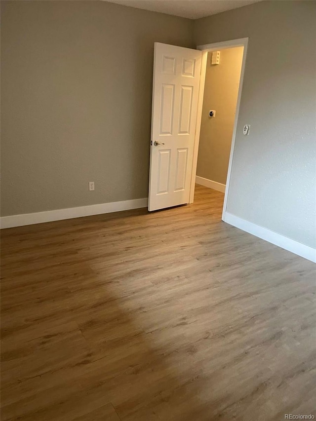 1415 Bacchus Dr Unit D9, Lafayette, CO 80026 - empty room featuring baseboards and wood finished floors