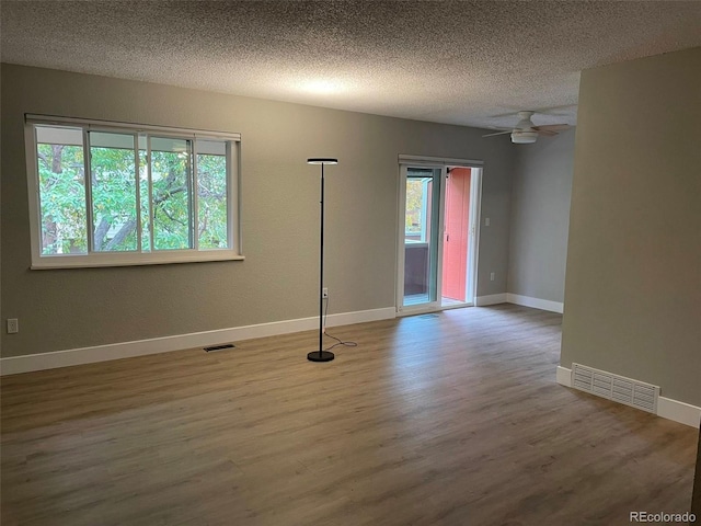 1415 Bacchus Dr Unit D9, Lafayette, CO 80026 - empty room with wood finished floors, a textured ceiling, and a ceiling fan