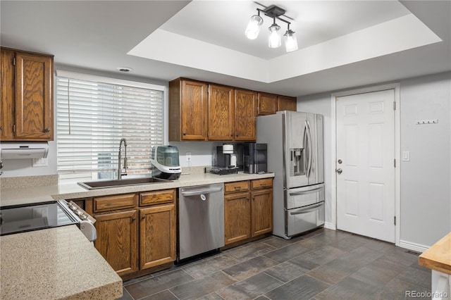 4028 S Atchison Way, Aurora, CO 80014 - kitchen featuring stainless steel appliances, brown cabinets, and light countertops
