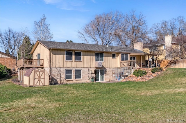 6735 E Lake Cir, Centennial, CO 80111 - rear view of property with an outdoor structure, a lawn, and a shed