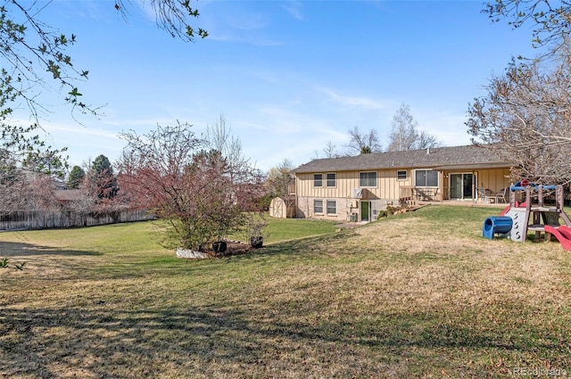 6735 E Lake Cir, Centennial, CO 80111 - back of property with fence, a shed, board and batten siding, a patio, and a lawn