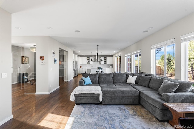 11023 Pastel Pt, Parker, CO 80134 - living room with recessed lighting, baseboards, and dark wood-style floors