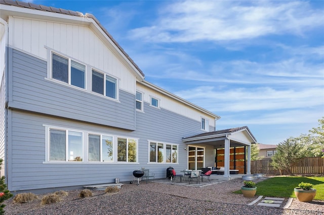 11023 Pastel Pt, Parker, CO 80134 - back of property with a patio, fence, and a yard