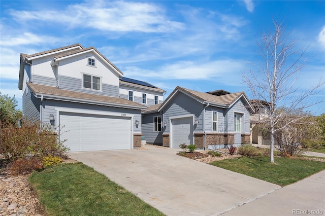 11023 Pastel Pt, Parker, CO 80134 - traditional-style home featuring an attached garage, driveway, a front lawn, and brick siding
