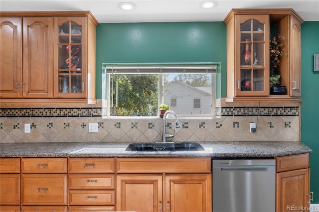 kitchen with sink, decorative backsplash, and dishwasher