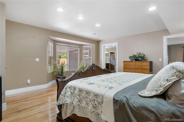 bedroom with light hardwood / wood-style flooring