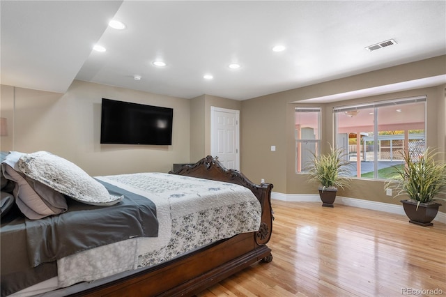 bedroom with light hardwood / wood-style floors