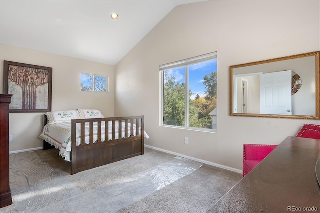 bedroom with high vaulted ceiling and carpet floors