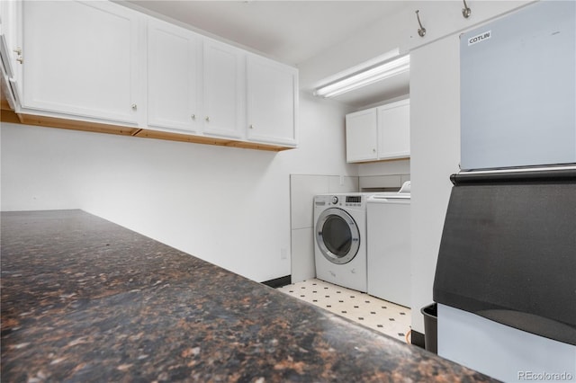 washroom with independent washer and dryer