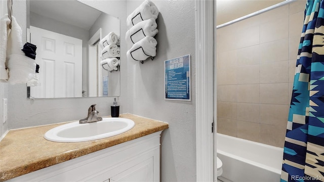 full bathroom with shower / bath combination with curtain, toilet, and vanity