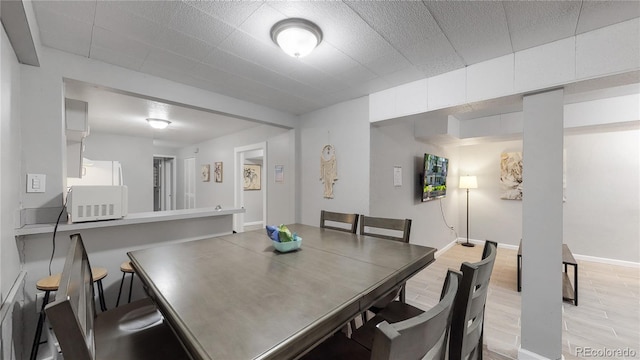 dining area with light wood-type flooring