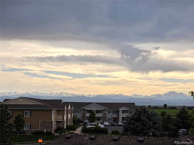 10818 Cimarron St Unit 206, Firestone, CO 80504 - view of front of property featuring a mountain view, a residential view, and brick siding