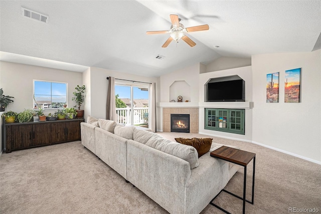 10818 Cimarron St Unit 206, Firestone, CO 80504 - living area featuring carpet floors, lofted ceiling, a ceiling fan, a fireplace, and baseboards