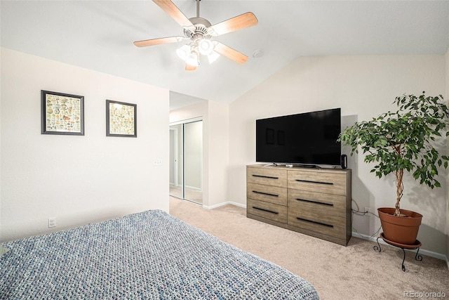 10818 Cimarron St Unit 206, Firestone, CO 80504 - bedroom featuring light colored carpet, vaulted ceiling, a closet, a ceiling fan, and baseboards