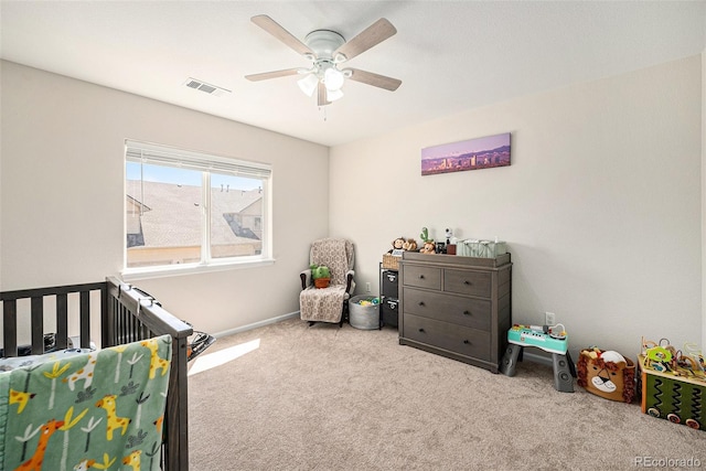 10818 Cimarron St Unit 206, Firestone, CO 80504 - bedroom with carpet, a crib, baseboards, and ceiling fan