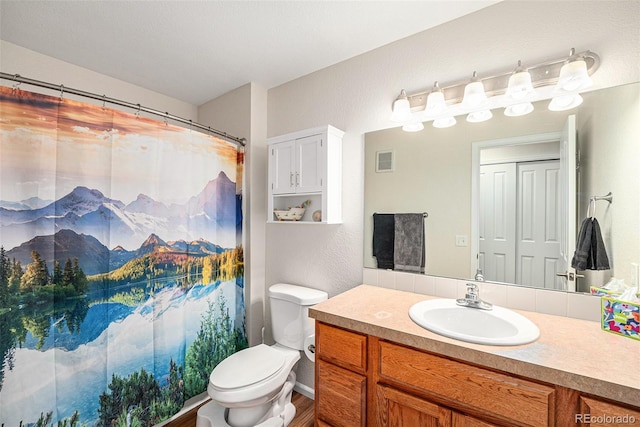 10818 Cimarron St Unit 206, Firestone, CO 80504 - bathroom with vanity, toilet, wood finished floors, and a shower with curtain