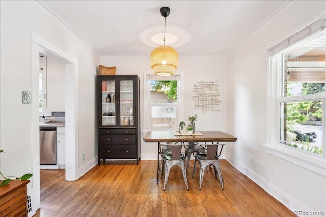 3622 Lowell Blvd, Denver, CO 80211 - dining area featuring light wood-style flooring and crown molding
