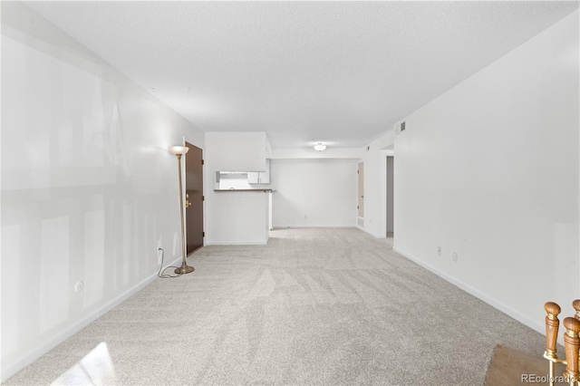 1758 S Pitkin Cir Unit A, Aurora, CO 80017 - unfurnished living room with light carpet and baseboards