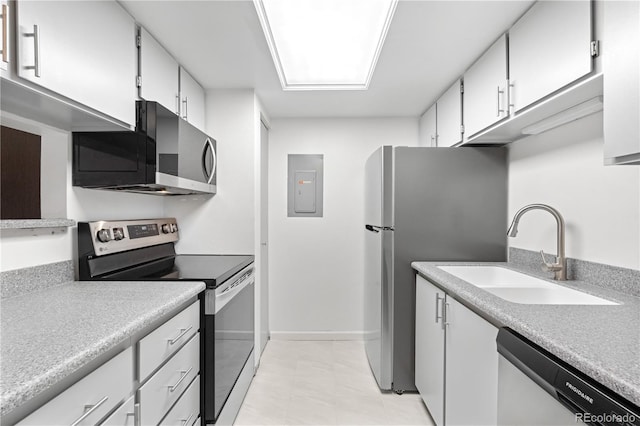 1758 S Pitkin Cir Unit A, Aurora, CO 80017 - kitchen with appliances with stainless steel finishes, white cabinets, light countertops, and electric panel