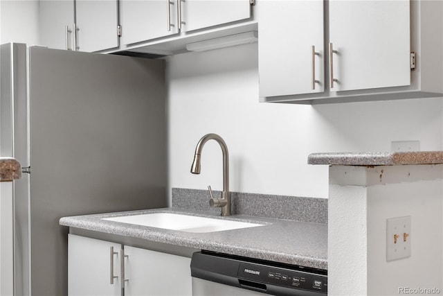 1758 S Pitkin Cir Unit A, Aurora, CO 80017 - kitchen featuring dishwashing machine, freestanding refrigerator, white cabinetry, and light countertops