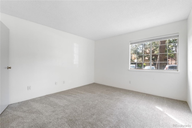1758 S Pitkin Cir Unit A, Aurora, CO 80017 - empty room with carpet flooring and a textured ceiling