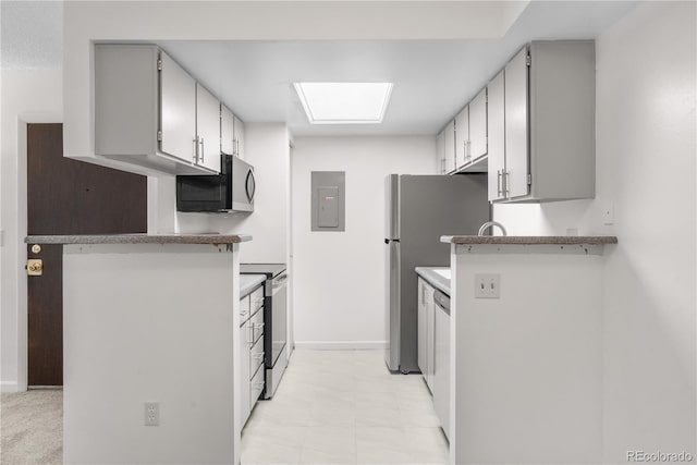 1758 S Pitkin Cir Unit A, Aurora, CO 80017 - kitchen featuring appliances with stainless steel finishes, electric panel, light countertops, and gray cabinets
