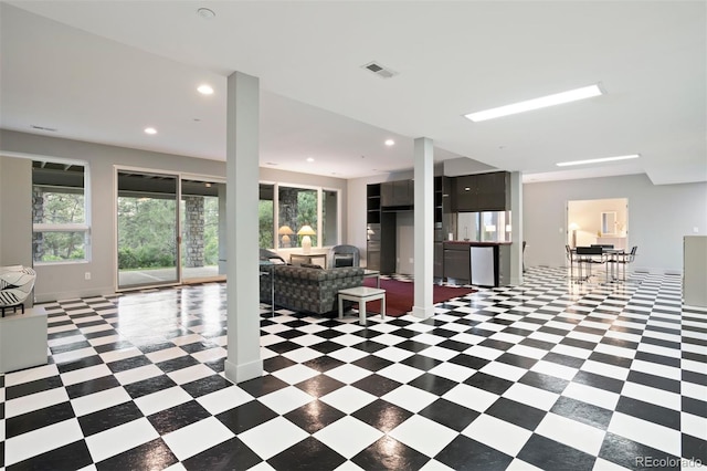 living area with recessed lighting, baseboards, visible vents, and light floors