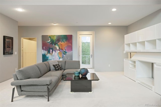 carpeted living room with recessed lighting